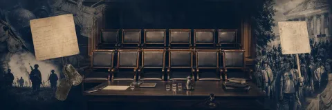 Vietnam-era draft card and protest placard near jury chairs